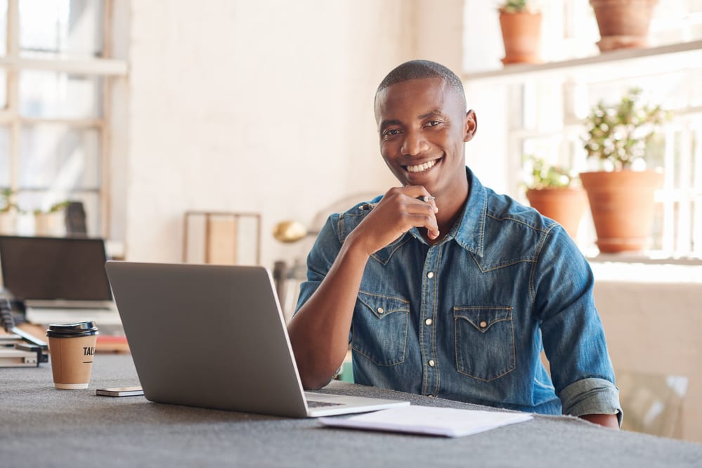 smiling man researching cash advance